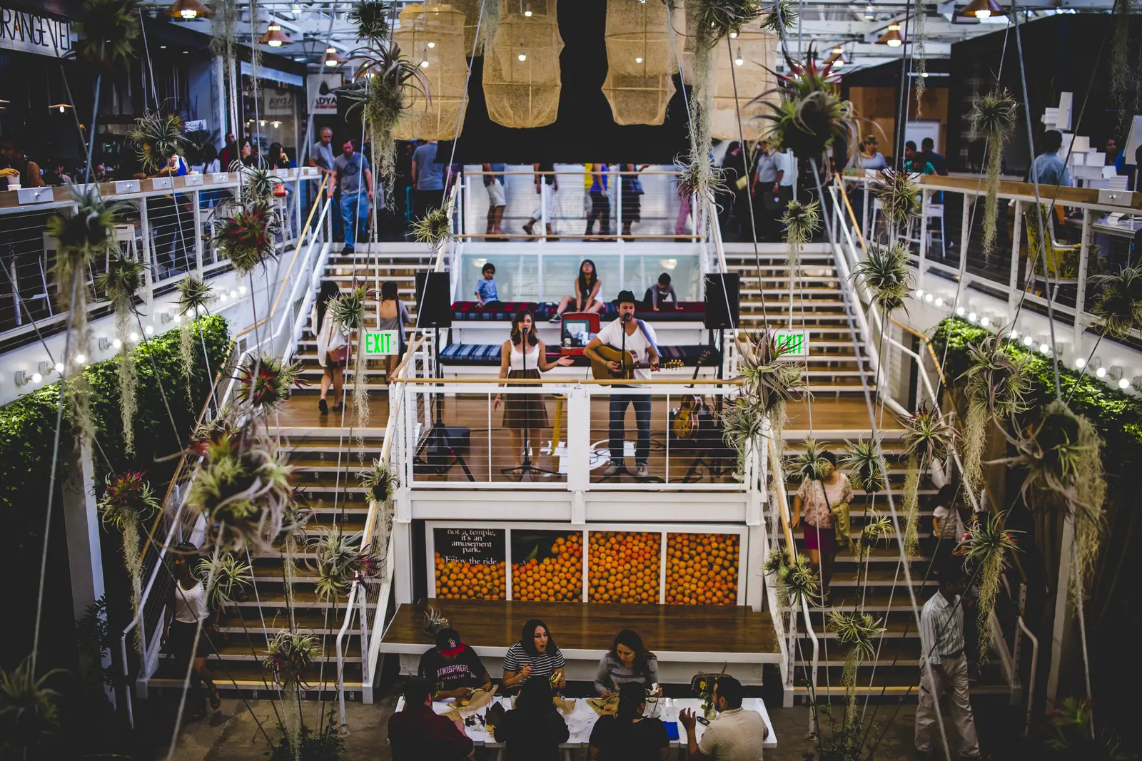 Two-story interior of the Anaheim Packing House during a live performance